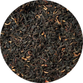 Close-up of black tea leaves in a circular arrangement