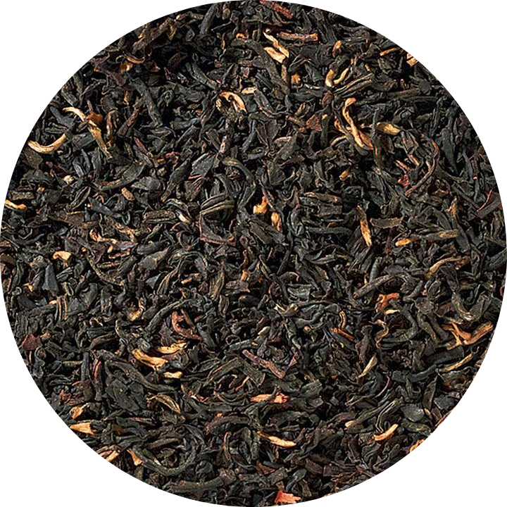 Close-up of black tea leaves in a circular arrangement