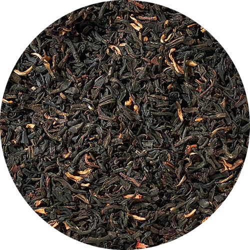 Close-up of black tea leaves in a circular arrangement