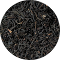 Close-up of black tea leaves on a white background