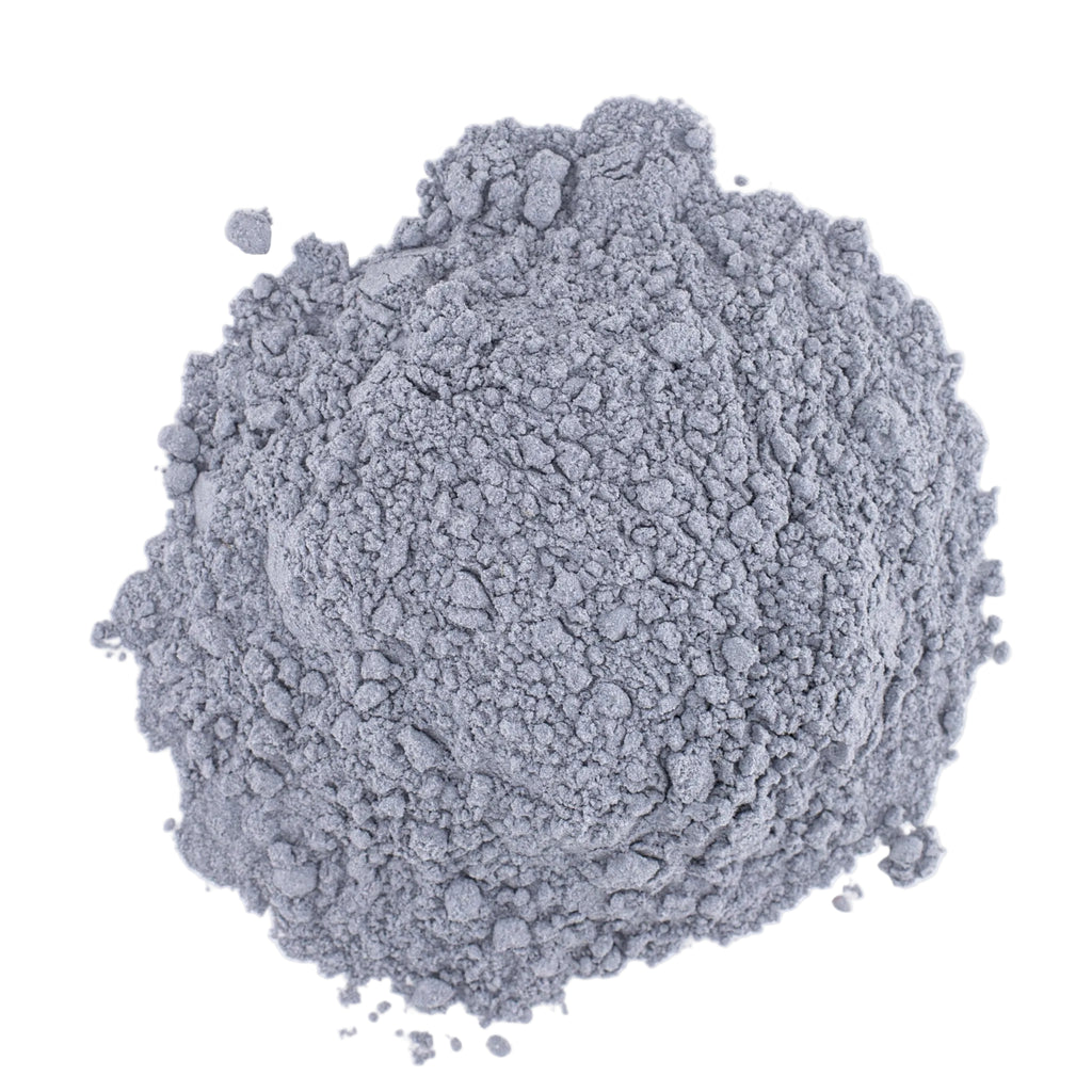 A mound of powdered blue raspberry matcha on a white background.