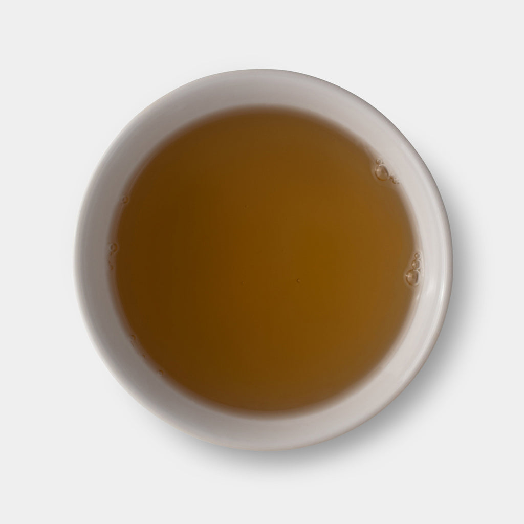 Milky oolong Taiwanese tea brewed in a cup