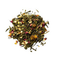 A mound of green tea leaves sprinkled with peaches, pears and rose petals