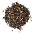 Tea leaves with blue flowers on a white background