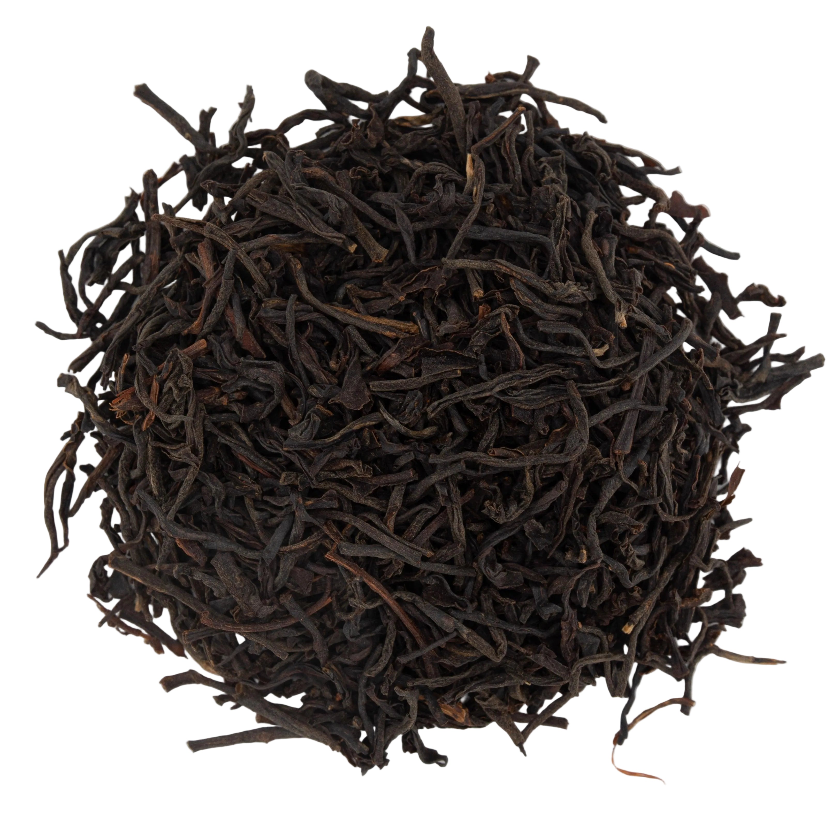 Close-up of dark brown dried Scottish Breakfast tea leaves on a white background